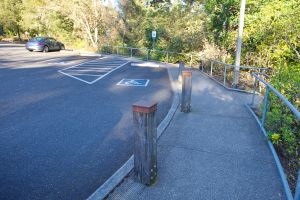2 ADA parking spaces on the north corner of the Visitor Center Parking lot leading to a ramp that leads to the Visitor Center courtyard.